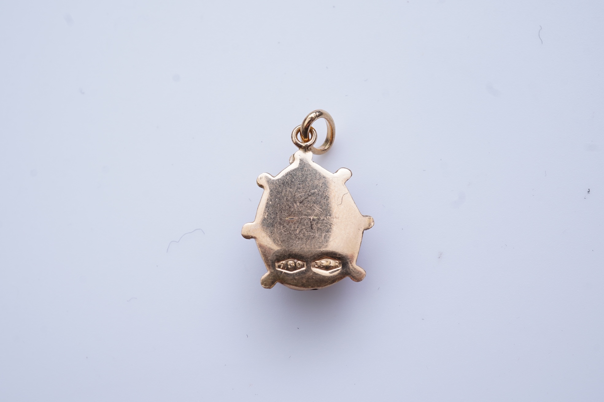 A gold and enamel pendant, Italy, 1960s